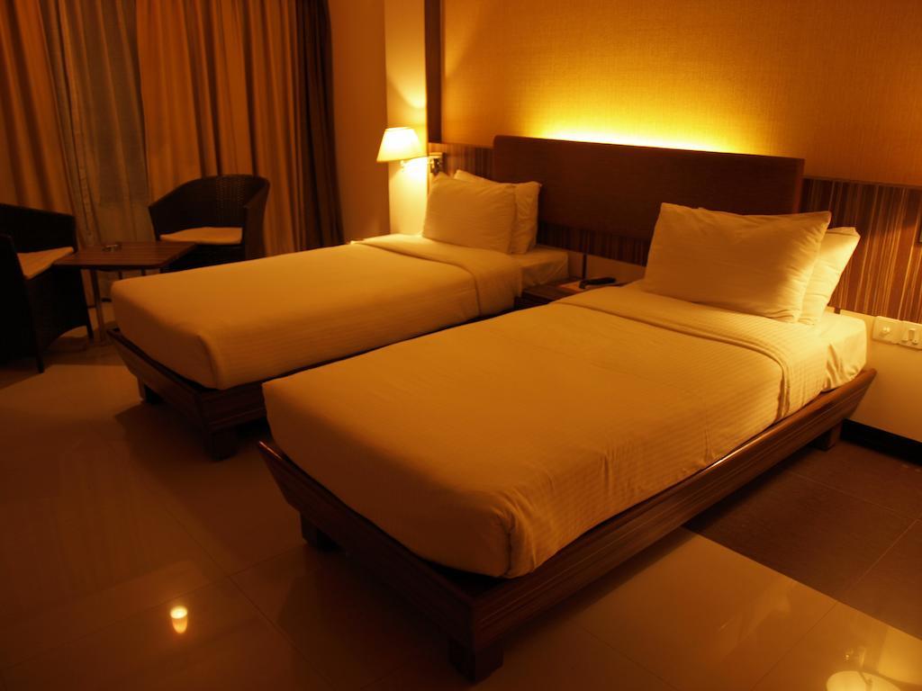 Kapila Business Hotel Púna Szoba fotó